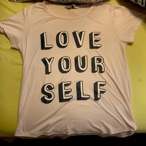 This shirt is slightly used. It is light pink, and it is a size small/medium.